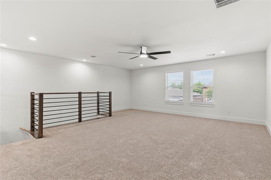 Unfurnished room featuring light colored carpet, recessed lighting, and ceiling fan Unfurnished room featuring light colored carpet, recessed lighting, and ceiling fan