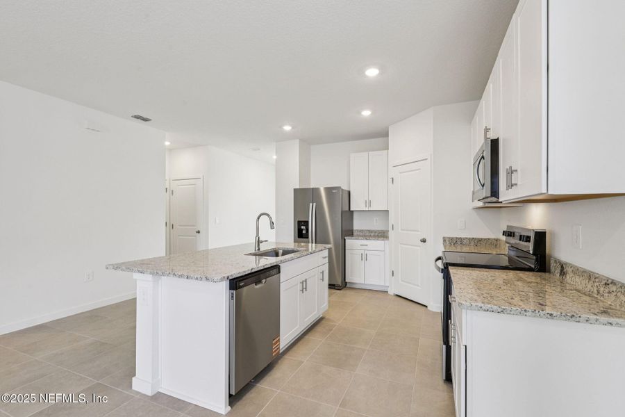 Furnished interior view inside a new home in Lakes at Bella Lago - Signature Series, Green Cove Springs (Image 12). Furnished interior view inside a new home in Lakes at Bella Lago - Signature Series, Green Cove Springs (Image 12).