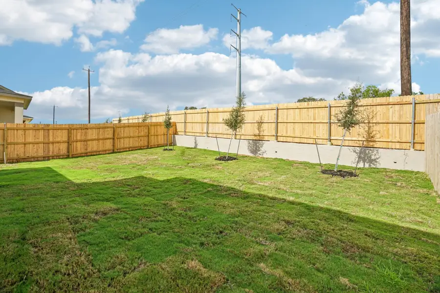 Exterior details and patio area of a home in The Meadows at Hunters Ranch, San Antonio (Image 22).