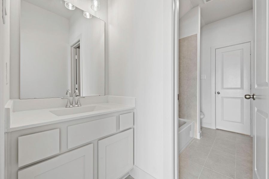 Furnished interior view inside a new home in Bridgeland, Cypress (Image 8).