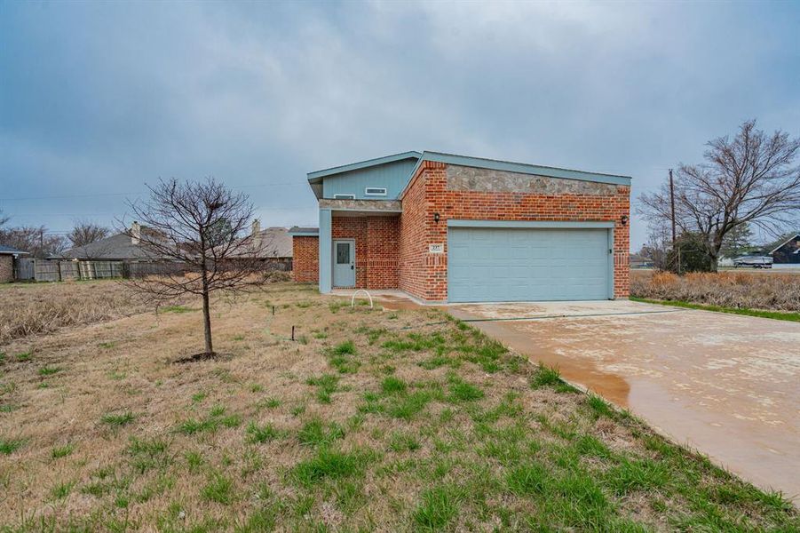 Front exterior of a new home in , Gun Barrel City, TX, highlighting curb appeal (Image 17). Front exterior of a new home in , Gun Barrel City, TX, highlighting curb appeal (Image 17).