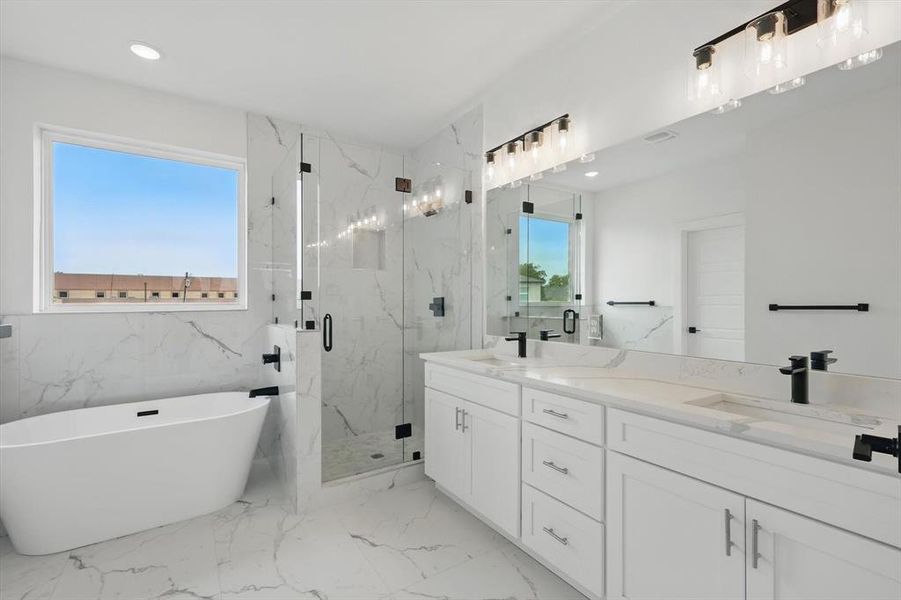 Full bathroom with double vanity, a marble finish shower, a soaking tub, marble finish floors, and recessed lighting