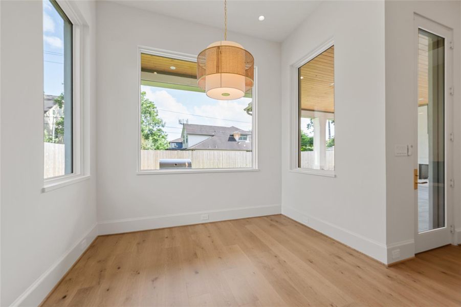 Breakfast room off the kitchen with views overlooking the back yard and easy access to the back porch