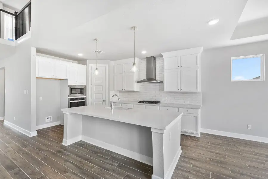 Furnished interior view inside a new home in Sunterra, Katy (Image 5).