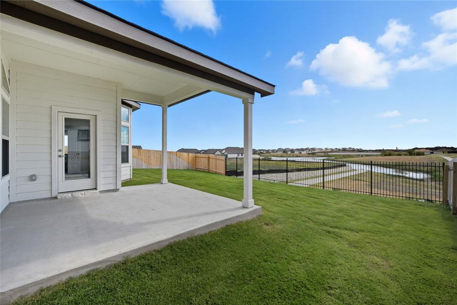 Fenced backyard featuring a patio area