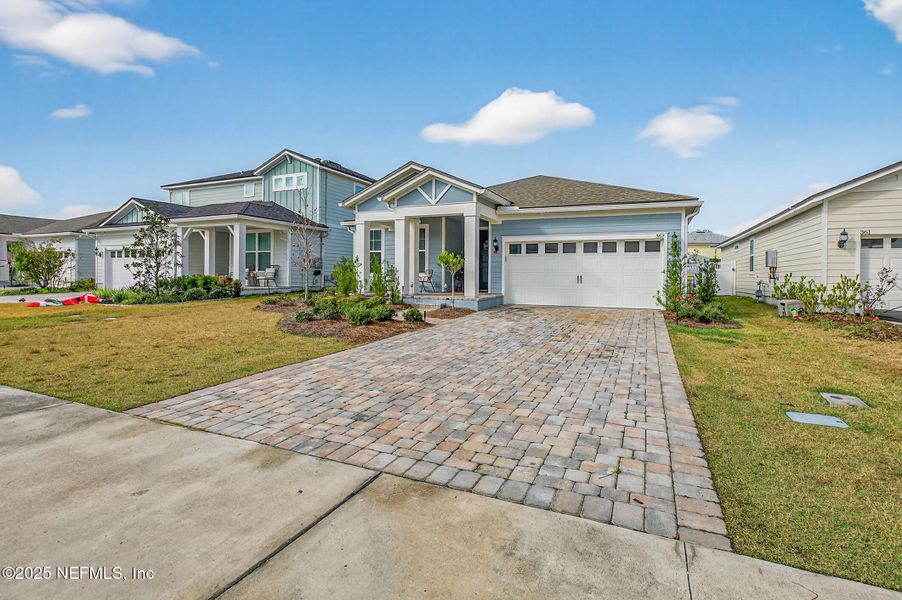 Front exterior of a new home in Forest Park at Wildlight, Yulee, FL, highlighting curb appeal (Image 1). Front exterior of a new home in Forest Park at Wildlight, Yulee, FL, highlighting curb appeal (Image 1).