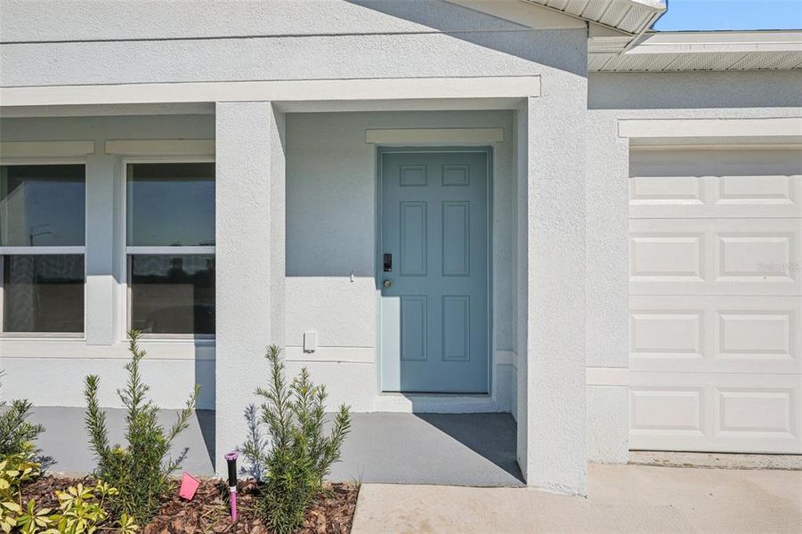 Exterior details and patio area of a home in The Enclave at Scenic Terrace, Haines City (Image 4).