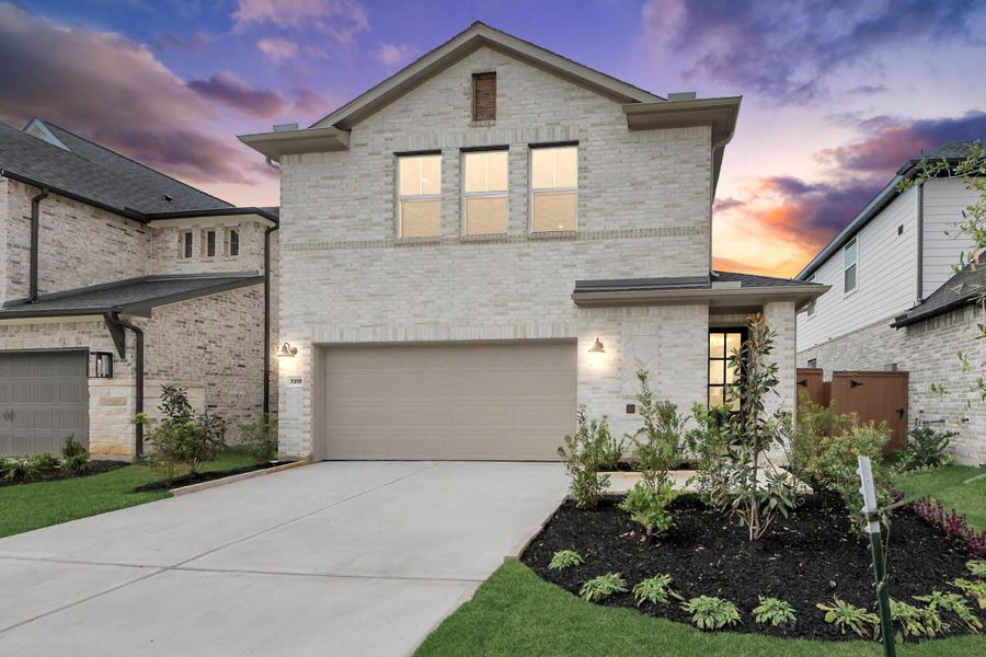 Front exterior of a new home in Elyson, Katy, TX, highlighting curb appeal (Image 2).