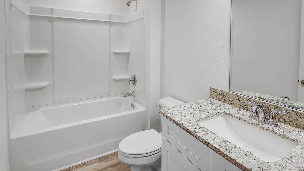 Representative furnished interior of a home built from the Lismore by D.R. Horton in Ashton Park Phase III, Freeport (Image 14).