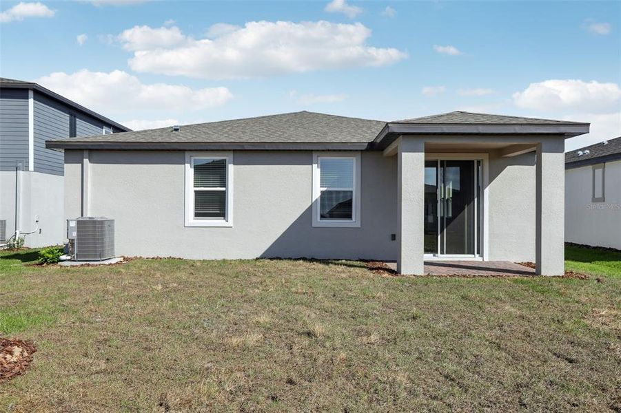 Front exterior of a new home in Springs at Lake Alfred - Signature Series, Lake Alfred, FL, highlighting curb appeal (Image 23).