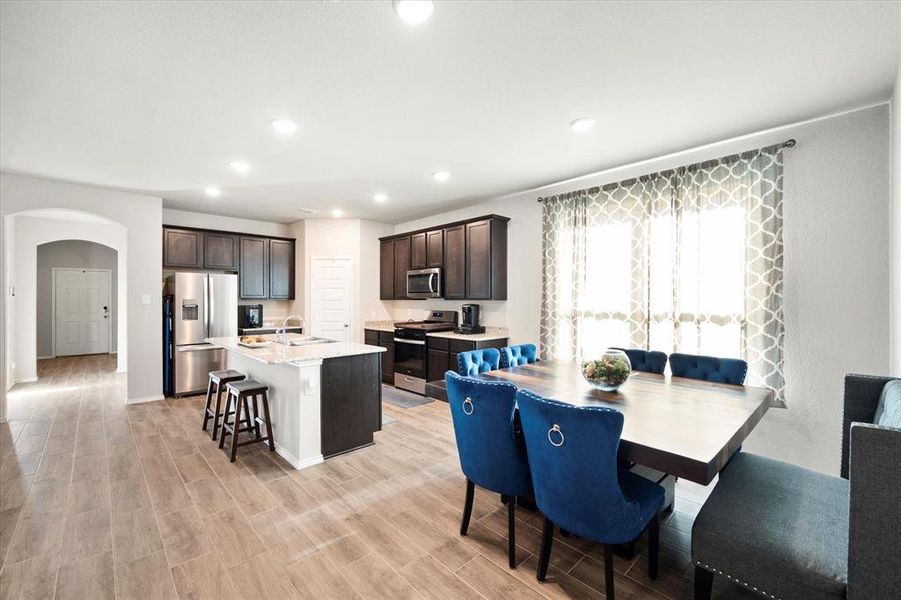 Dining room boast natural light and open to kitchen and living