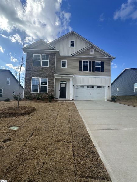 Front exterior of a new home in Shiloh Trail, Wellford, SC, highlighting curb appeal (Image 1).
