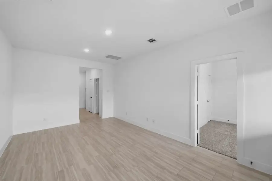 Representative unfurnished interior of a home built from the Margaux by Chesmar Homes in Bridgeland Chateau, Cypress (Image 41).