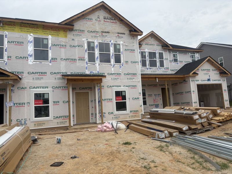 Front exterior of a new home in Caroleton Townhomes, Grovetown, GA, highlighting curb appeal (Image 2). Front exterior of a new home in Caroleton Townhomes, Grovetown, GA, highlighting curb appeal (Image 2).