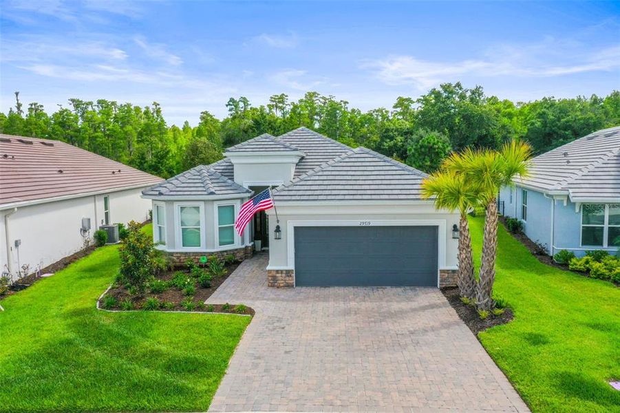 Front exterior of a new home in , Wesley Chapel, FL, highlighting curb appeal (Image 22).