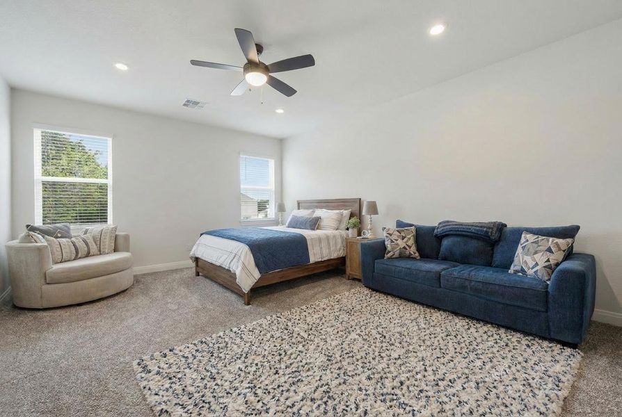 Comfortable bedroom retreat with plush carpet and ample natural light from multiple windows. Comfortable bedroom retreat with plush carpet and ample natural light from multiple windows.