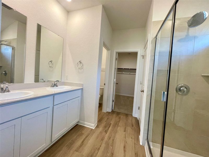 Double vanity and an oversized shower.