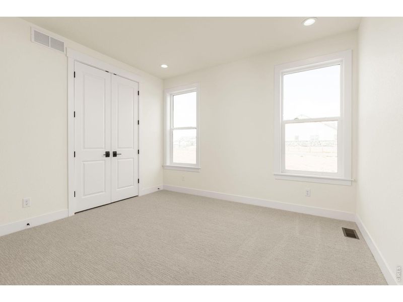 Spacious, unfurnished interior of a new home in RainDance, Windsor (Image 30).