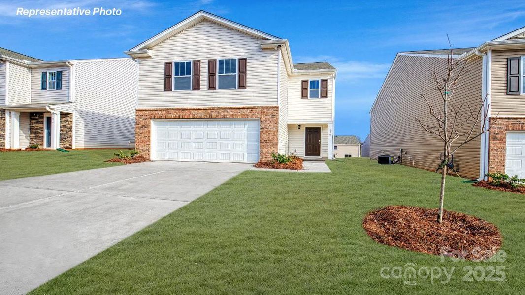 Front exterior of a new home in Woodhaven at Chester, Chester, SC, highlighting curb appeal (Image 1). Front exterior of a new home in Woodhaven at Chester, Chester, SC, highlighting curb appeal (Image 1).