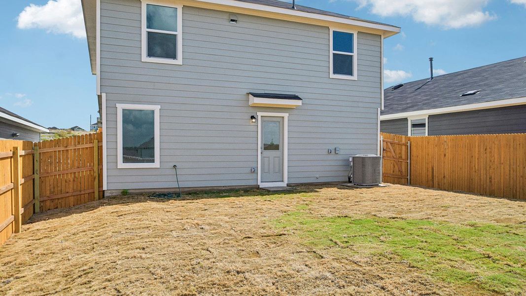 Exterior details and patio area of a home in Prairie Lakes, Buda (Image 20).