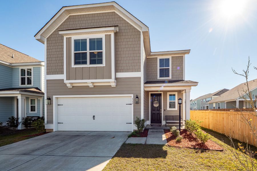 Front exterior of a new home in High Point at Foxbank, Moncks Corner, SC, highlighting curb appeal (Image 1).