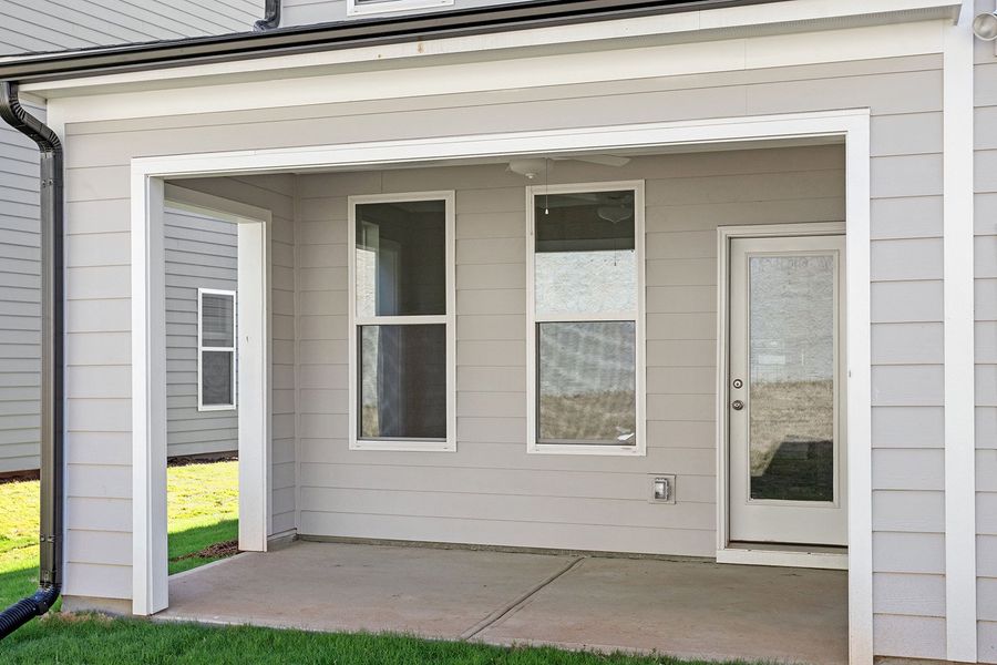 Exterior details and patio area of a home in Ovation at Sweetbrier, Durham (Image 3).