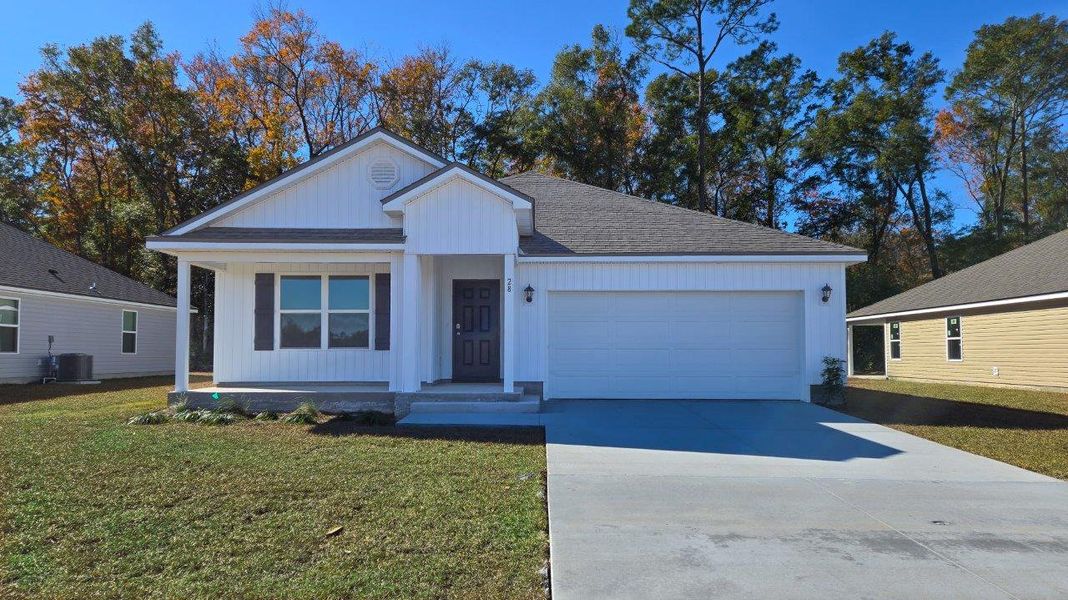 Front exterior of a new home in Wesley Park, Crawfordville, FL, highlighting curb appeal (Image 1). Front exterior of a new home in Wesley Park, Crawfordville, FL, highlighting curb appeal (Image 1).