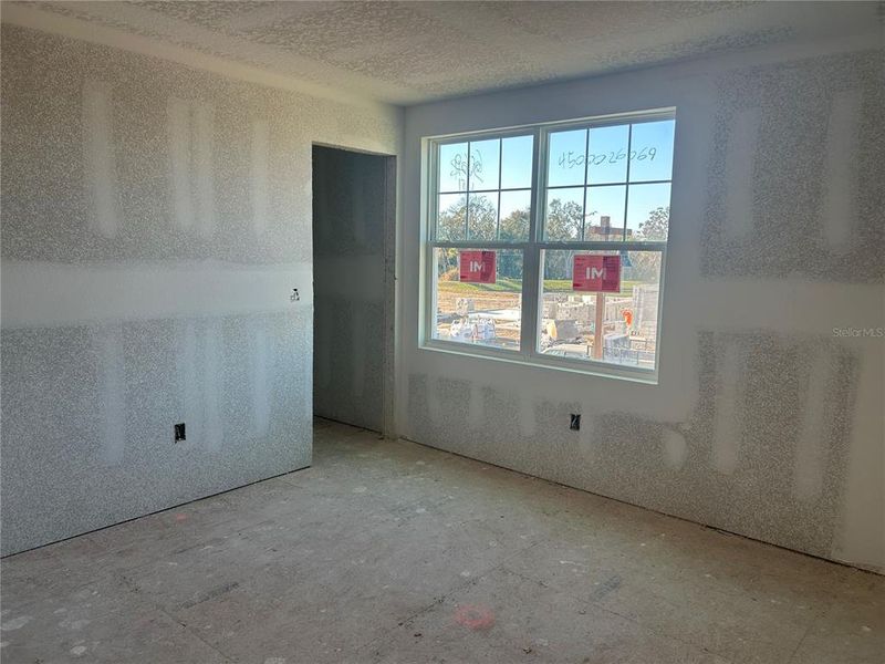 In-progress construction of a new home in Oakfield Trails Signature, Parrish, FL (Image 18).