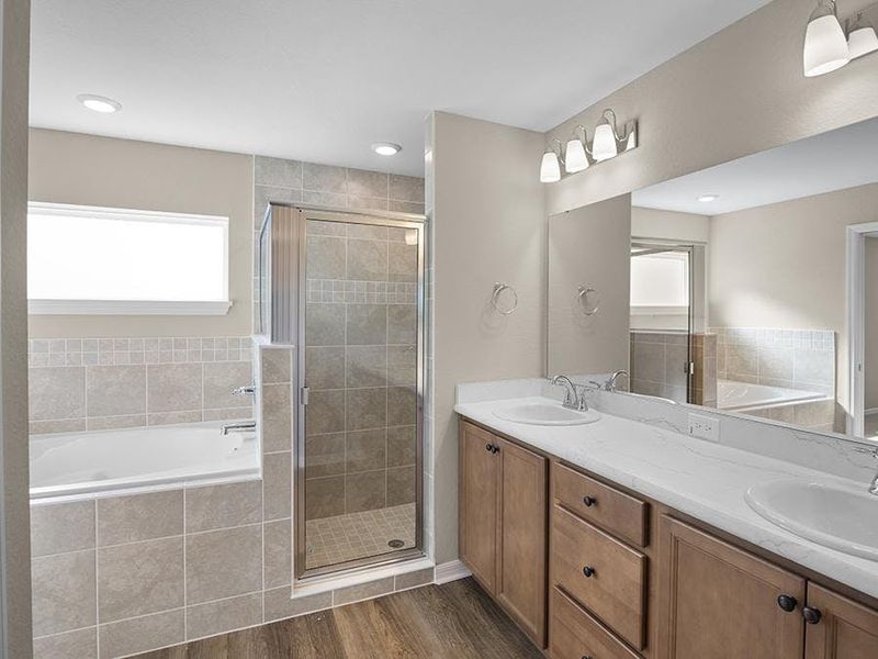 An optional luxury bath adds a spa-like garden tub - Raychel by Highland Homes An optional luxury bath adds a spa-like garden tub - Raychel by Highland Homes
