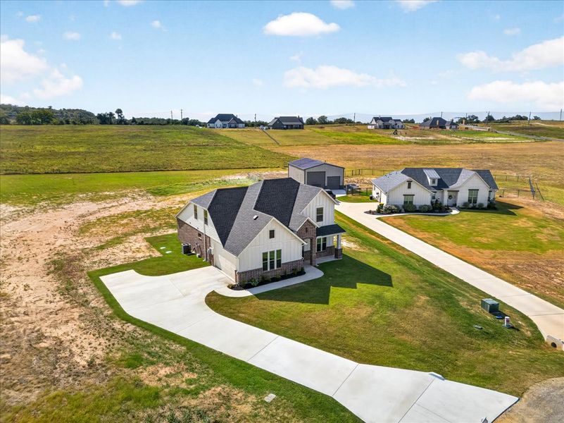 Front exterior of a new home in The Ranches at Valley View, Springtown, TX, highlighting curb appeal (Image 31).