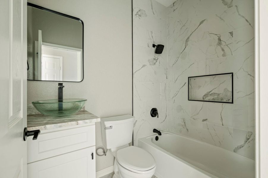 Full bathroom featuring tub / shower combination and vanity