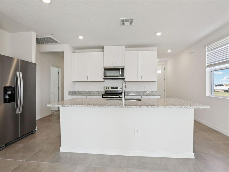 Furnished interior view inside a new home in Oakfield Trails - Premier Series, Parrish (Image 9).