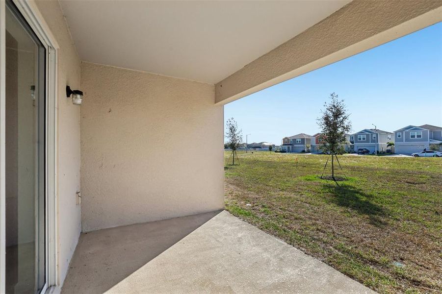 Exterior details and patio area of a home in The Collection at Bradbury Creek, Haines City (Image 10).