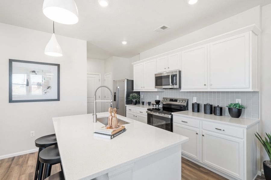 Representative furnished interior of a home built from the 2003 by Risewell Homes in Harvest Crossing, Aurora (Image 5).
