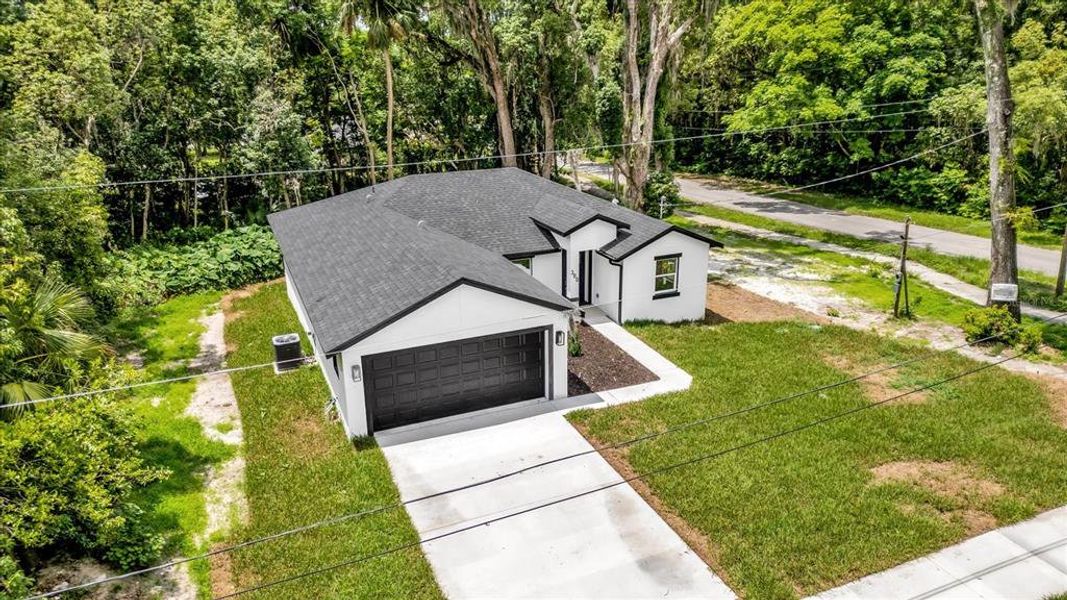 Front exterior of a new home in , Orange City, FL, highlighting curb appeal (Image 18). Front exterior of a new home in , Orange City, FL, highlighting curb appeal (Image 18).