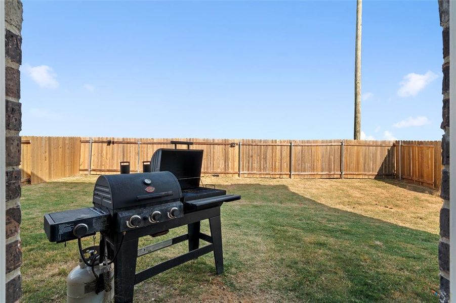 View of fenced backyard