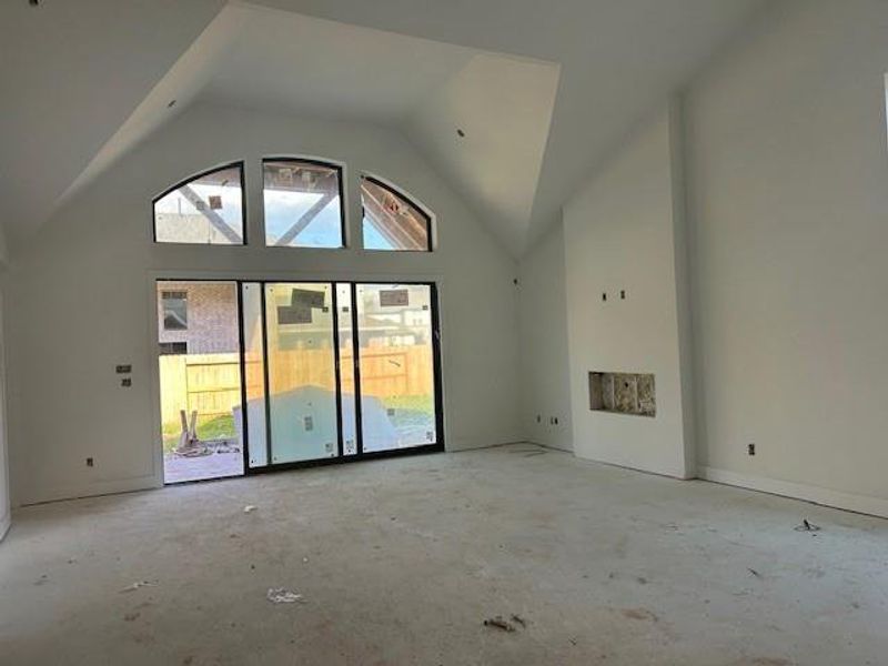 Family room comes with slider doors leading to the back yard and covered patio.