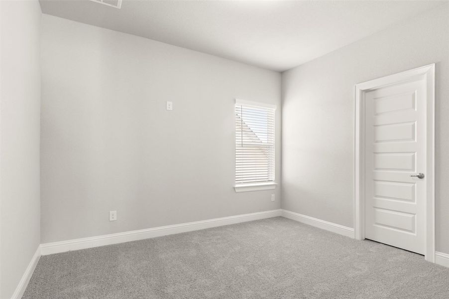 Carpeted spare room with baseboards Carpeted spare room with baseboards