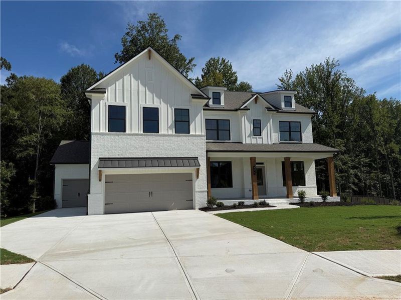 Front exterior of a new home in Rosewood Lake Estates, Hoschton, GA, highlighting curb appeal (Image 54).