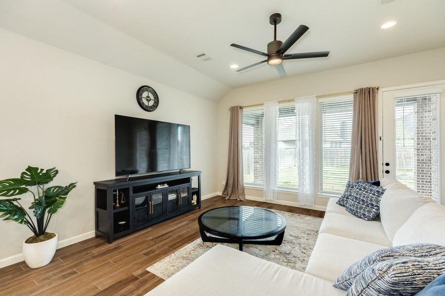 Family room with views of the covered patio; rear door is glass. Family room with views of the covered patio; rear door is glass.