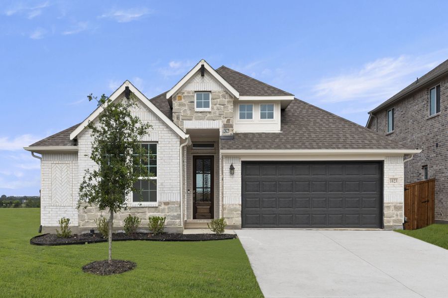 Front exterior of a new home in Timberbrook, Justin, TX, highlighting curb appeal (Image 1). Front exterior of a new home in Timberbrook, Justin, TX, highlighting curb appeal (Image 1).
