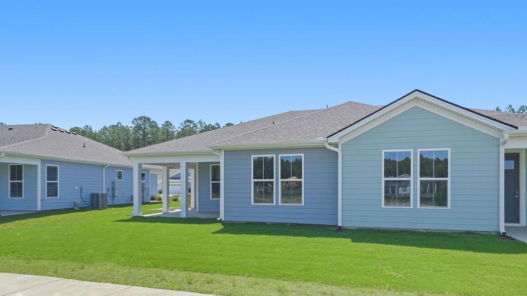 Exterior details and patio area of a home in Sun City Hilton Head, Bluffton (Image 24).