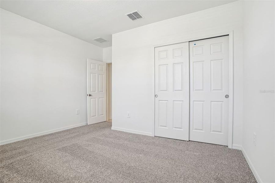 Spacious, unfurnished interior of a new home in Lake Deer Estates - Signature Series, Poinciana (Image 27). Spacious, unfurnished interior of a new home in Lake Deer Estates - Signature Series, Poinciana (Image 27).