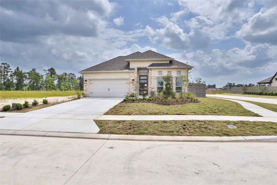 Front exterior of a new home in Artavia, Conroe, TX, highlighting curb appeal (Image 2).