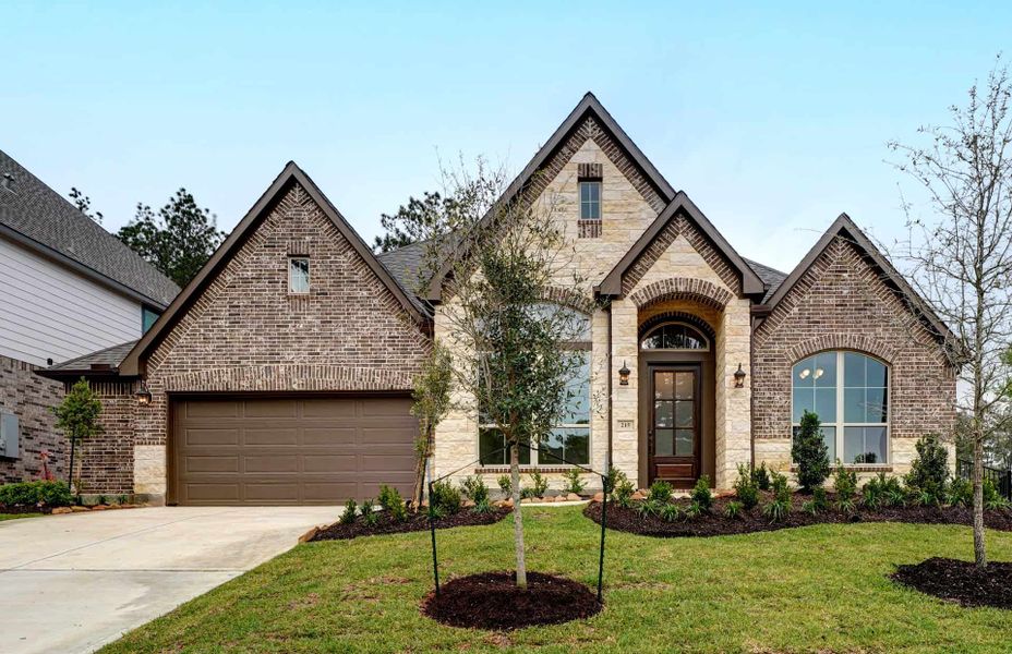 Representative exterior photo of a completed home built from the 3030 by Ravenna Homes in The Woodlands Hills 65′, Willis, TX (Image 24). Representative exterior photo of a completed home built from the 3030 by Ravenna Homes in The Woodlands Hills 65′, Willis, TX (Image 24).