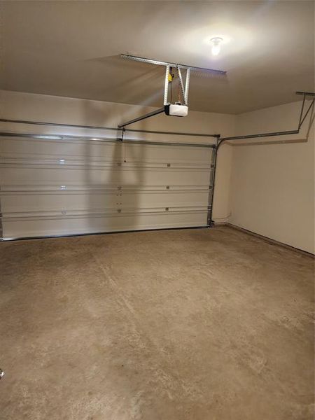 Garage with a garage door opener Garage with a garage door opener