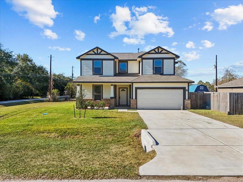 Front exterior of a new home in Mecom Way, Hitchcock, TX, highlighting curb appeal (Image 1). Front exterior of a new home in Mecom Way, Hitchcock, TX, highlighting curb appeal (Image 1).
