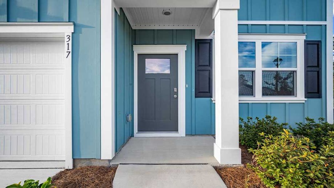 Front exterior of a new home in Fernhill Farms, Statesboro, GA, highlighting curb appeal (Image 2).