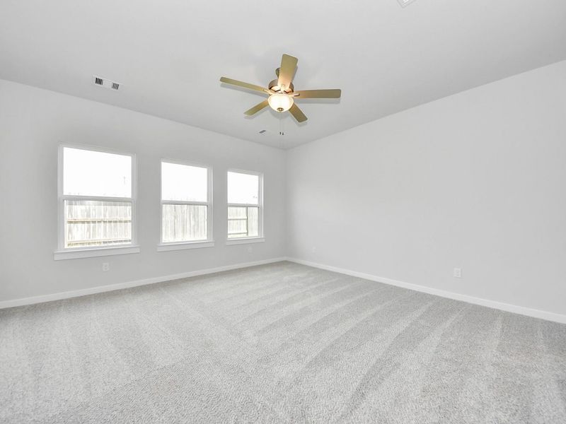 Spacious, unfurnished interior of a new home in Sunterra, Katy (Image 20).
