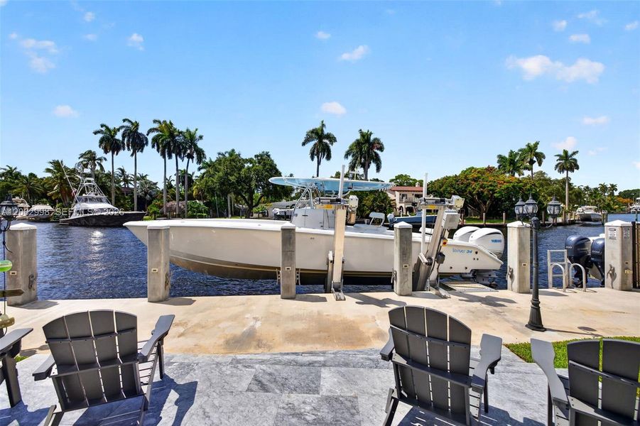 New concrete dock and seawall with 20k electric boat lift, 50 amp electric and water in dock pedestal, fish cleaning station and dock ladder
